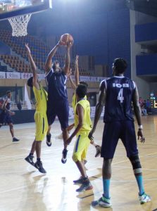 Abhilek Paul of IOB asserts his presence in the paint against his shorter Goan opponents