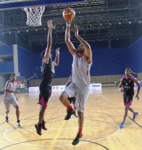 Mihir Pandey of IOB Chennai attempts a layup against Kerala Police