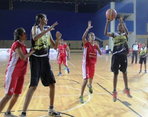 Nisha Netam of Chhattisgarh about to shoot a jumper against Kerala