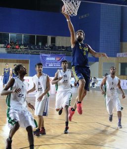 ONGC's star Vishesh Bhriguvanshi makes a layup against Bhiwani Club, Haryana