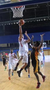 Pratham Singh of IOB lays the ball up against North Western Railway